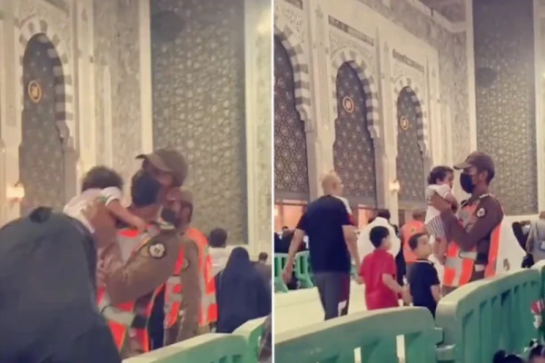 Saudi guard takes care of baby so that mother can pray at Grand Mosque of Makkah