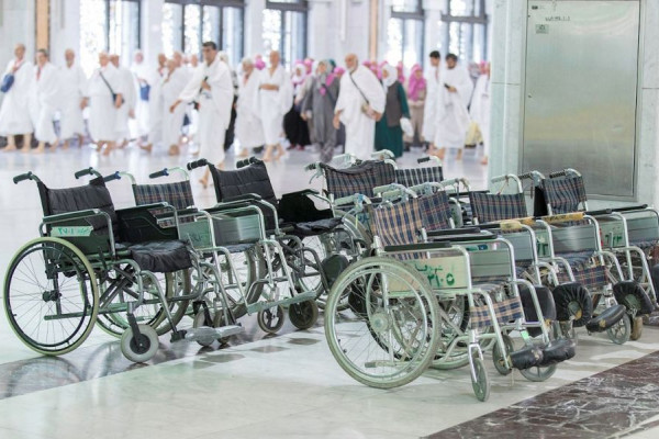 Fleet of electric vehicles and wheelchairs laid on for elderly and infirm pilgrims