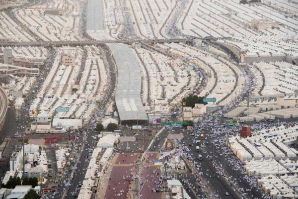 White sea of humanity surge to Arafat at climax of Haj